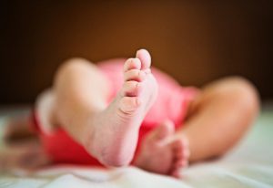 newborn infant feet closeup