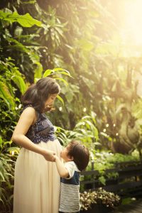 boy kissing mama pregnant matenrity photoshoot cloud dome