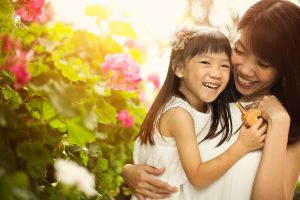 laughing girl and mother inside flower dome photoshoot