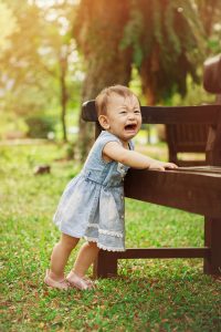 adorable crying baby girl at hort park