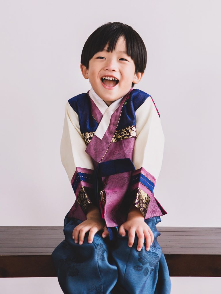 Little Korean boy in hanbok at Oh Dear Studio taking photos with natural light