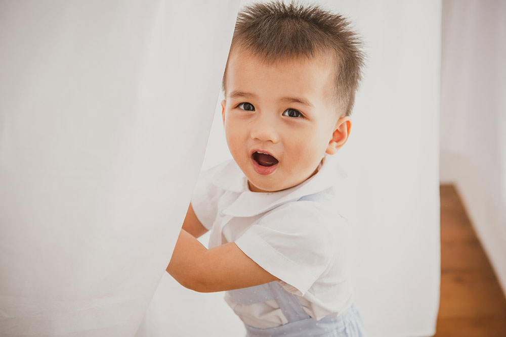 toddler boy laughing