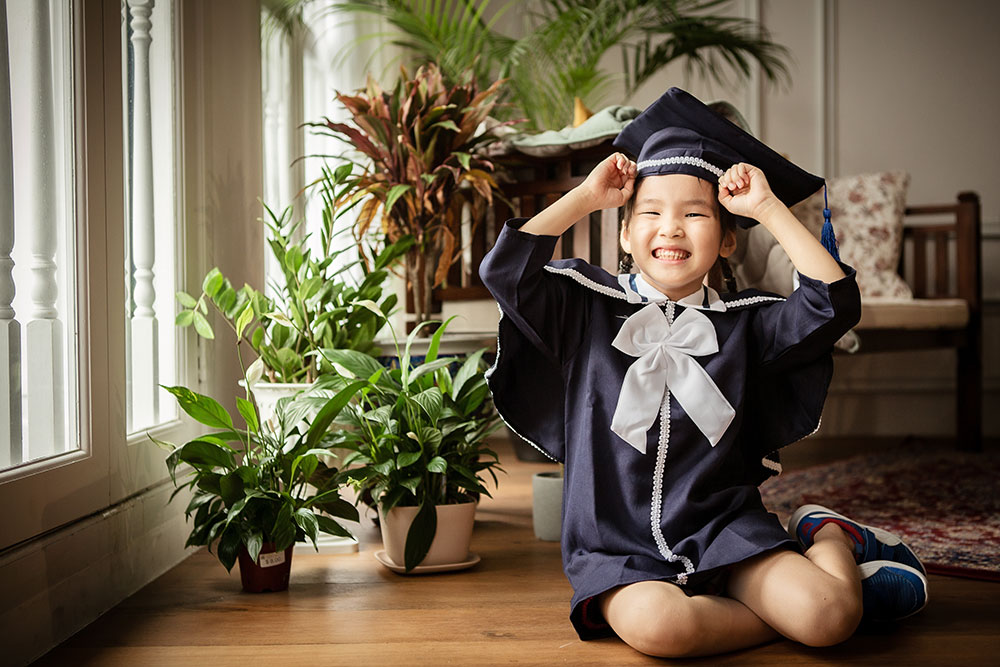 Happy k2 graduating little girl smiling