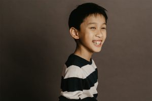 tween studio portrait smiling