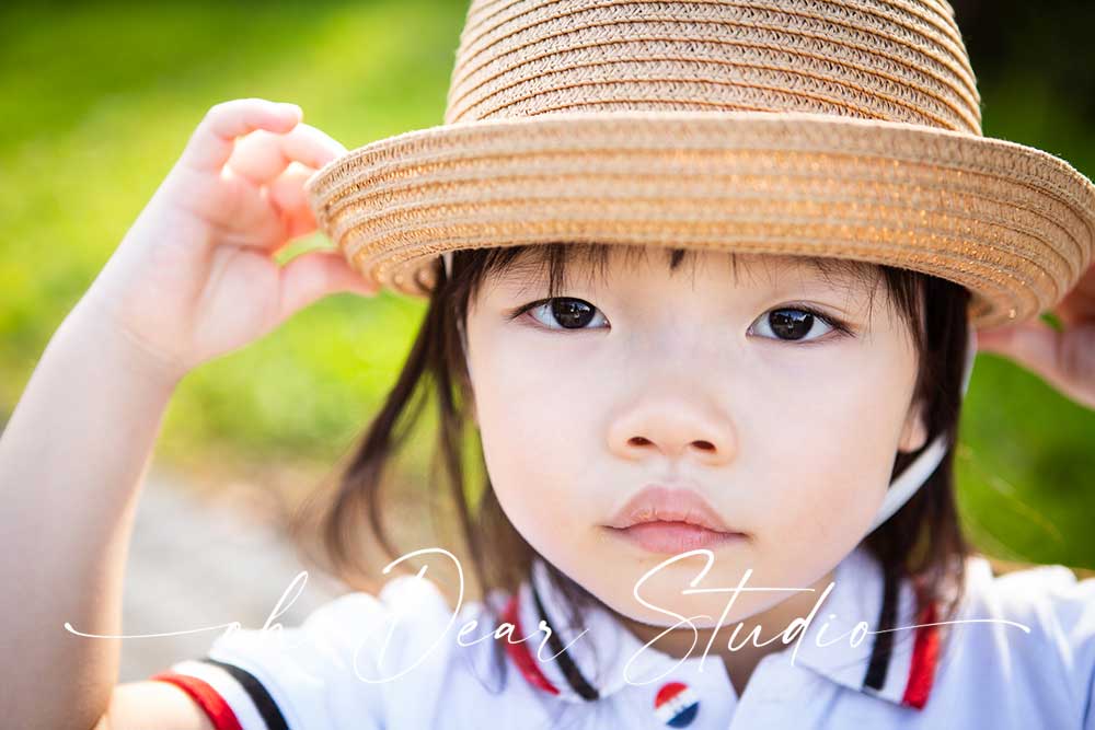 four years old wearing straw hat Jurong Lake Garden