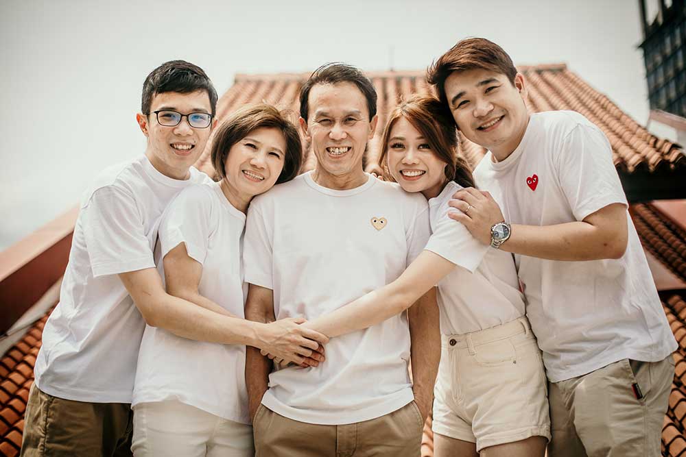 adult family on rooftop 