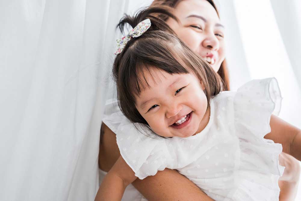 Two years old toddler and mommy