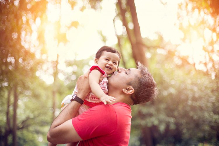 Father Kissing His Baby Daughter