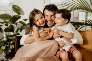 happy father hugging children photo shoot