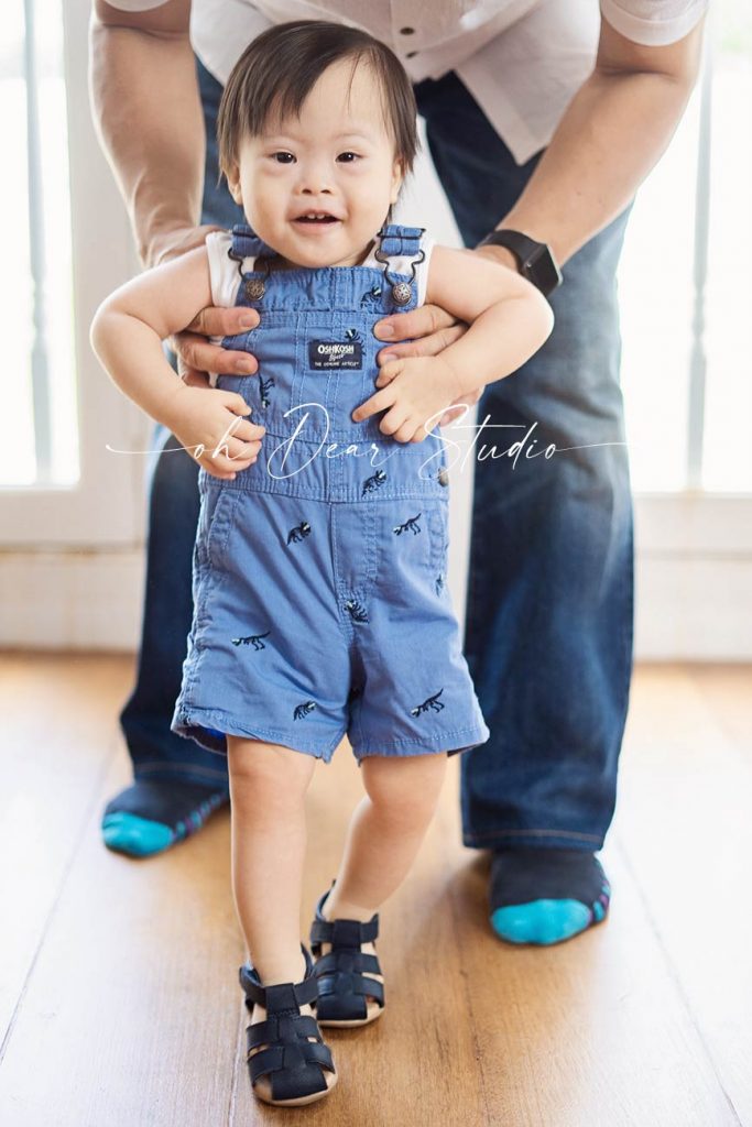 toddler boy smiling photoshoot in Oh Dear Studio
