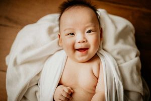 smiling 100 days old baby