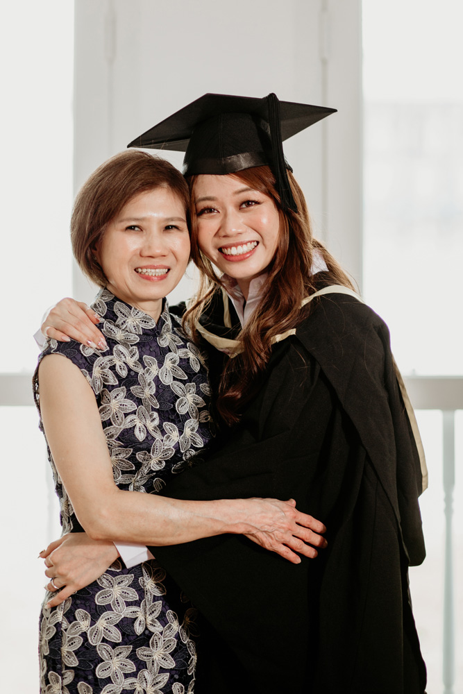 smiling hugging mother natural light studio photo