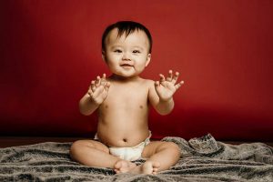 laughing baby boy one year old studio