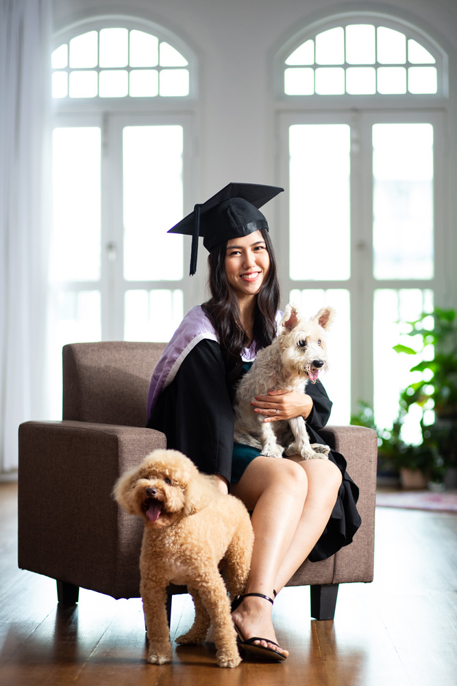 graduate photoshoot with two pet dogs