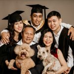 five pax family graduation studio with pet dogs