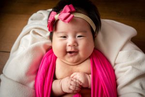 smiling 100 days old baby girl photo