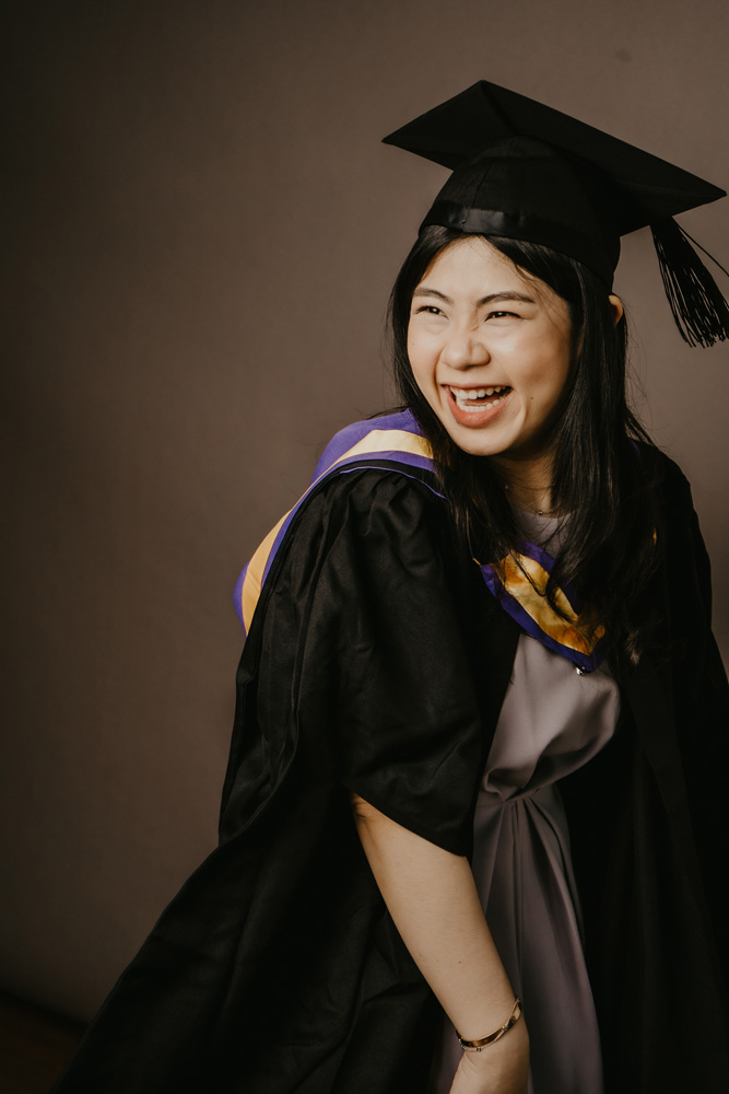 candid laughing graduate photoshoot protrait