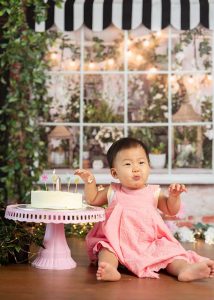 pink floral cake smash first year photoshoot