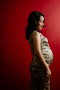 pregnancy photoshoot red studio backdrop