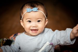 ten months old smiling baby girl photoshoot