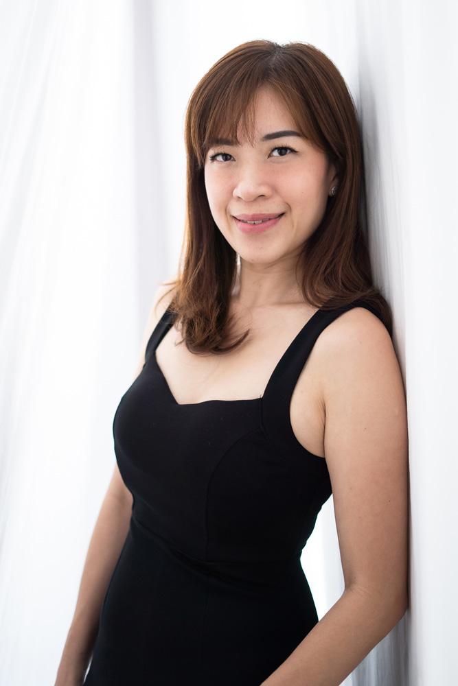 A portrait shot of a lady in a black dress