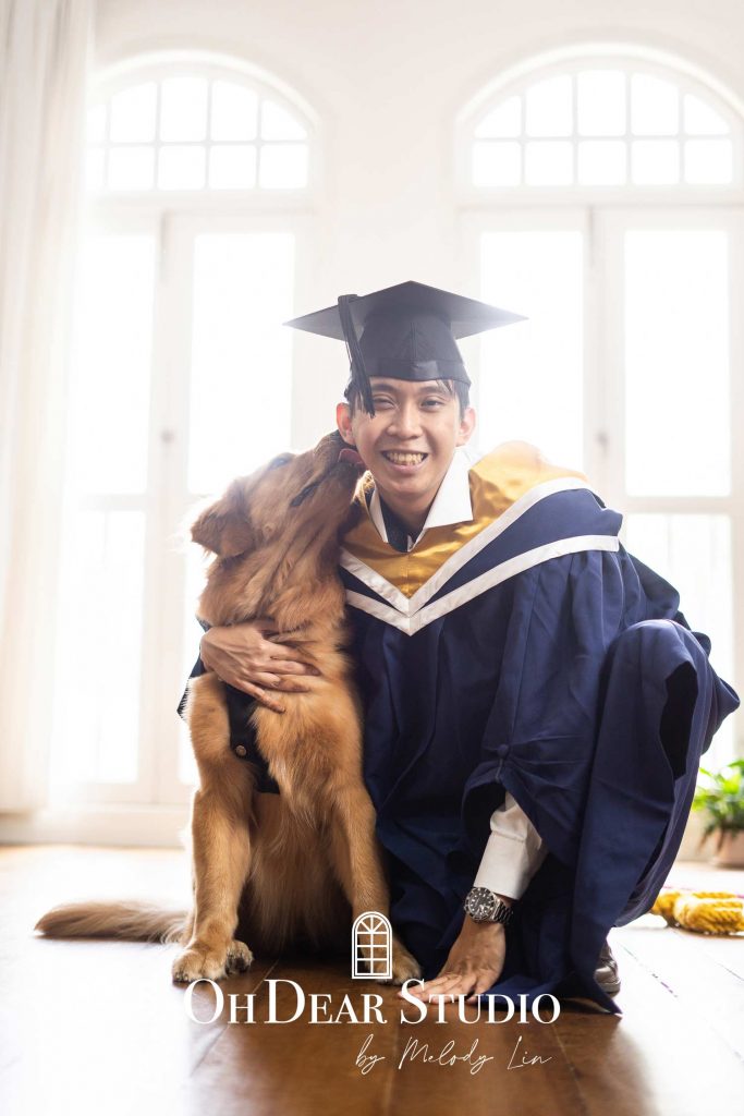 Graduation solo portrait natural light with pet golden retriever