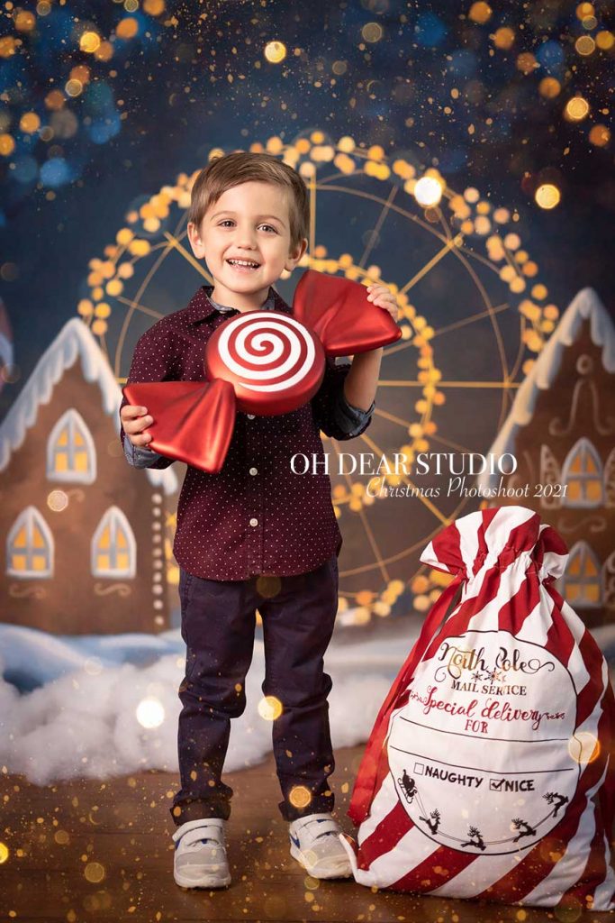 Christmas photoshoot snow carousel smiling boy 2021