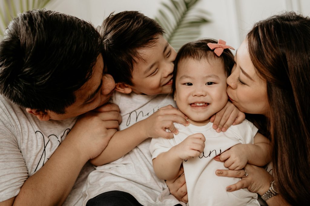 candid laughing family photoshoot studio