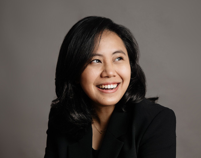 lady CEO friendly formal corporate studio business lady in business suit smiling brightly for a photoshoot