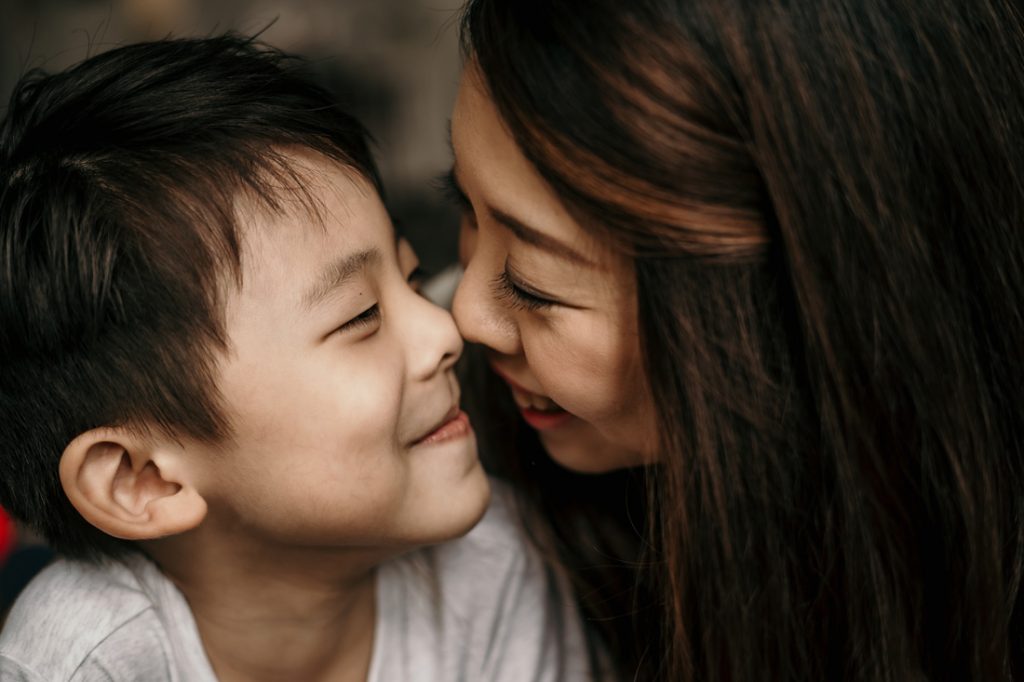 cute precious moment nose to nose mother and 6 year old son