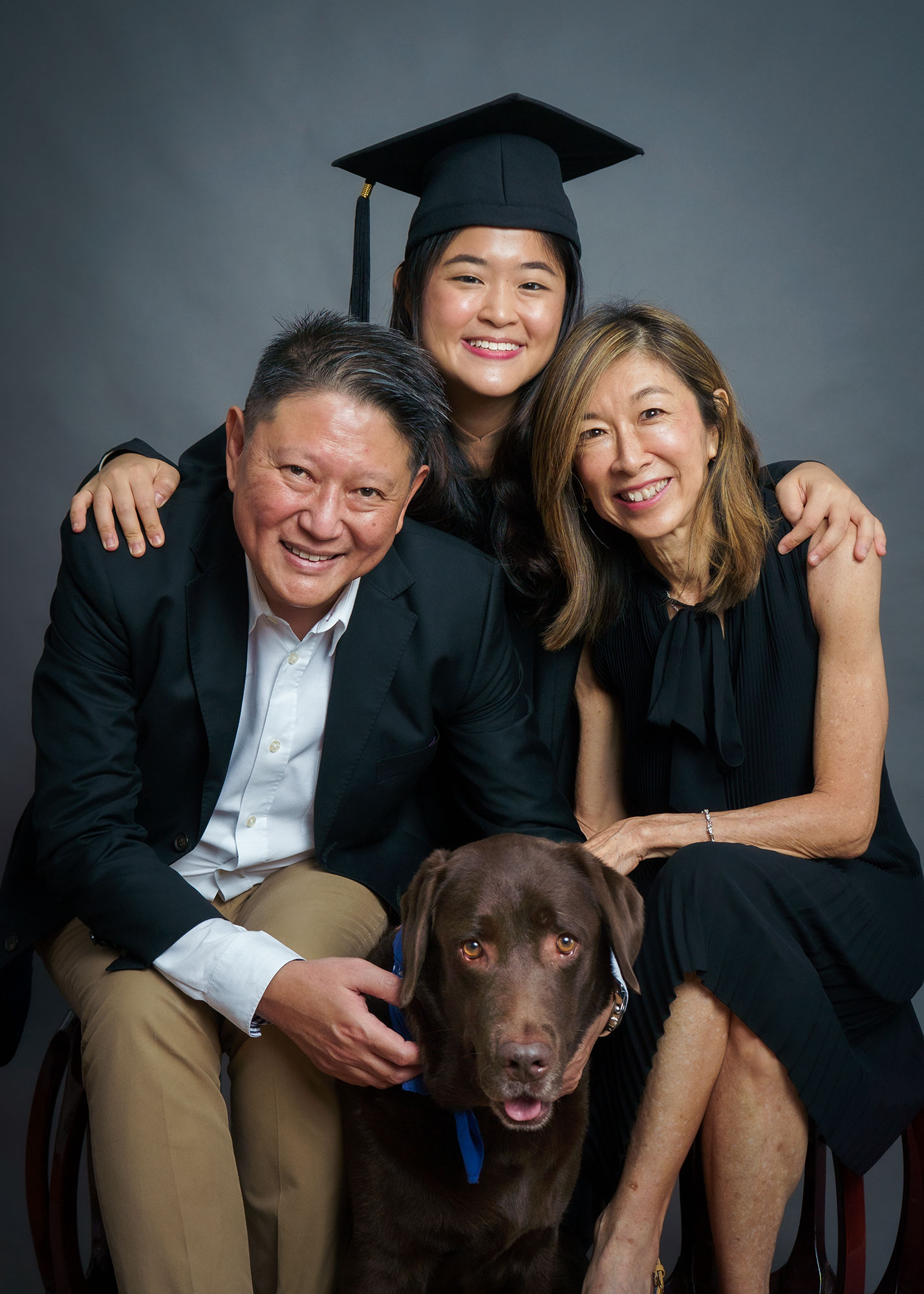 3pax graduation photoshoot SMU studio with pet dog