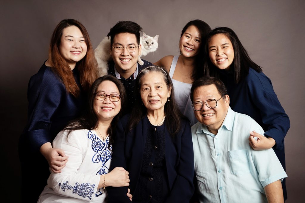 extended family photoshoot with pet cat studio Singapore