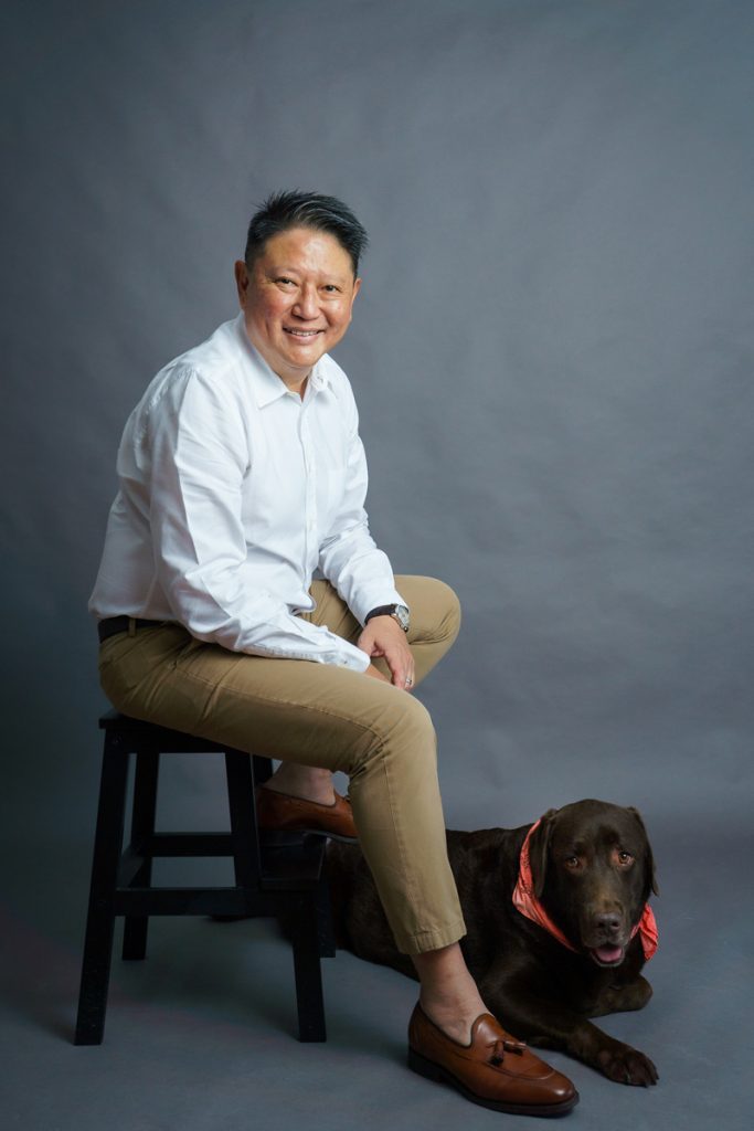 man and his pet dog photography studio formal smiling sitting