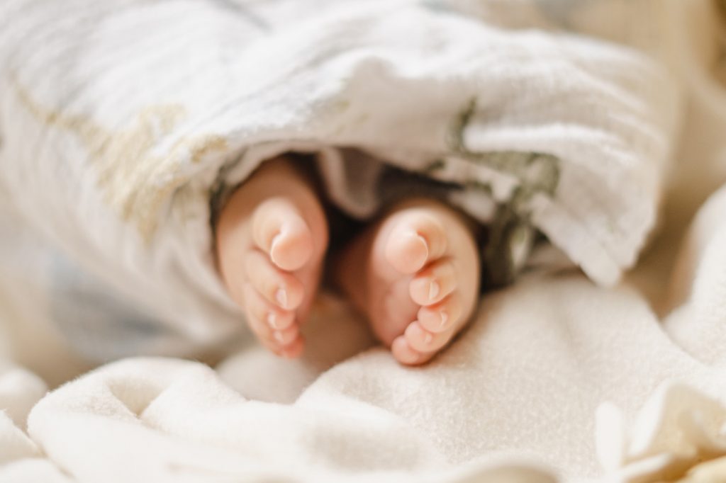 detail shot feet of 100 day old baby