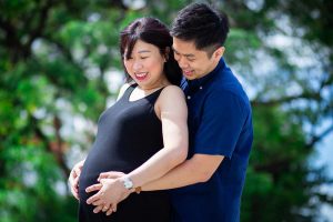 couple maternity smiling greenery studio rooftop 