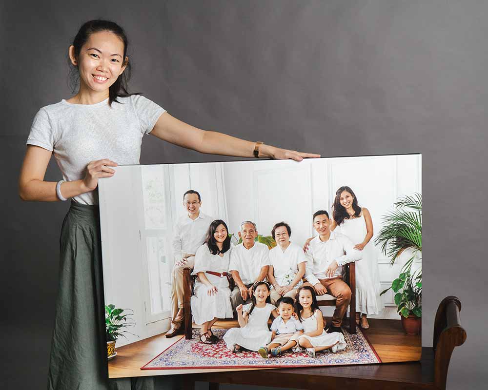 Professional photographer showing off her printed canvas