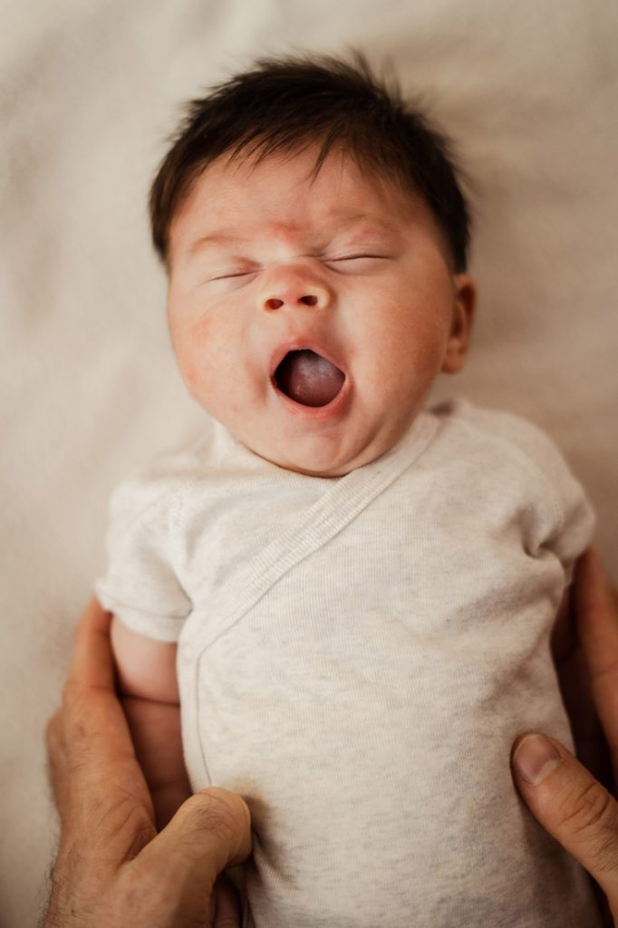 cute baby newborn infant yawning