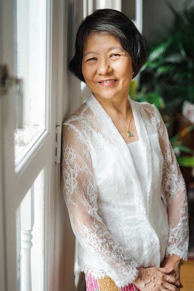 grandmother smiling photoshoot in Kebaya peranakan