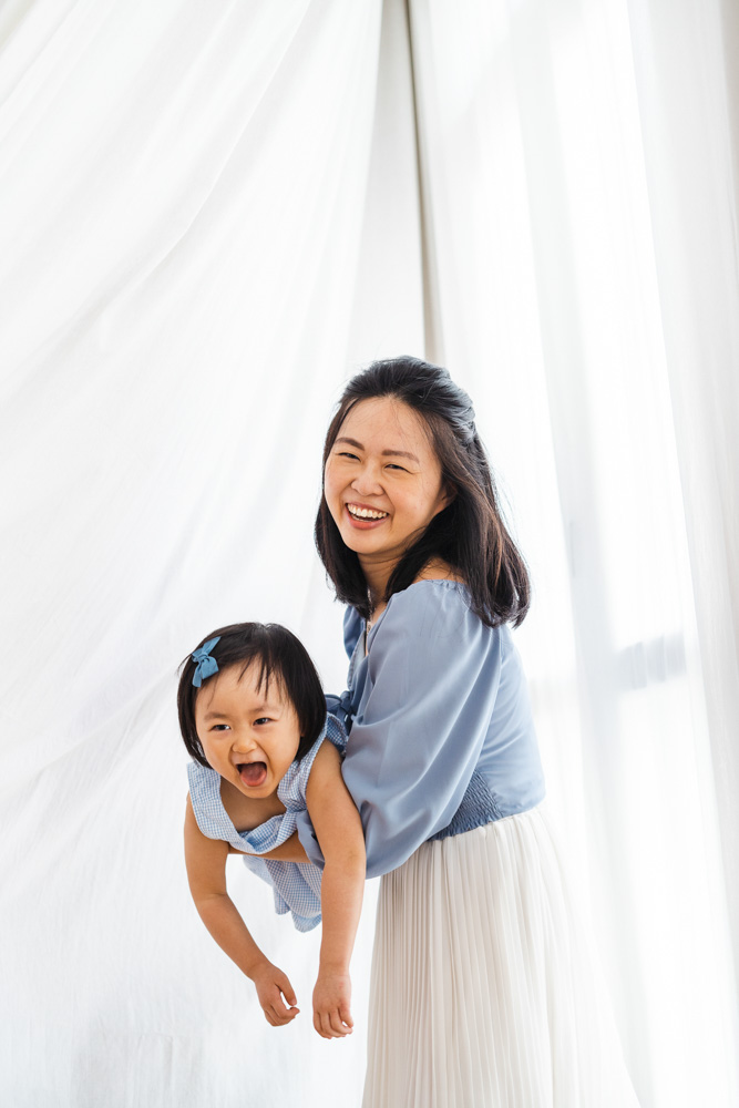 toddler and mother laughing photoshoot studio