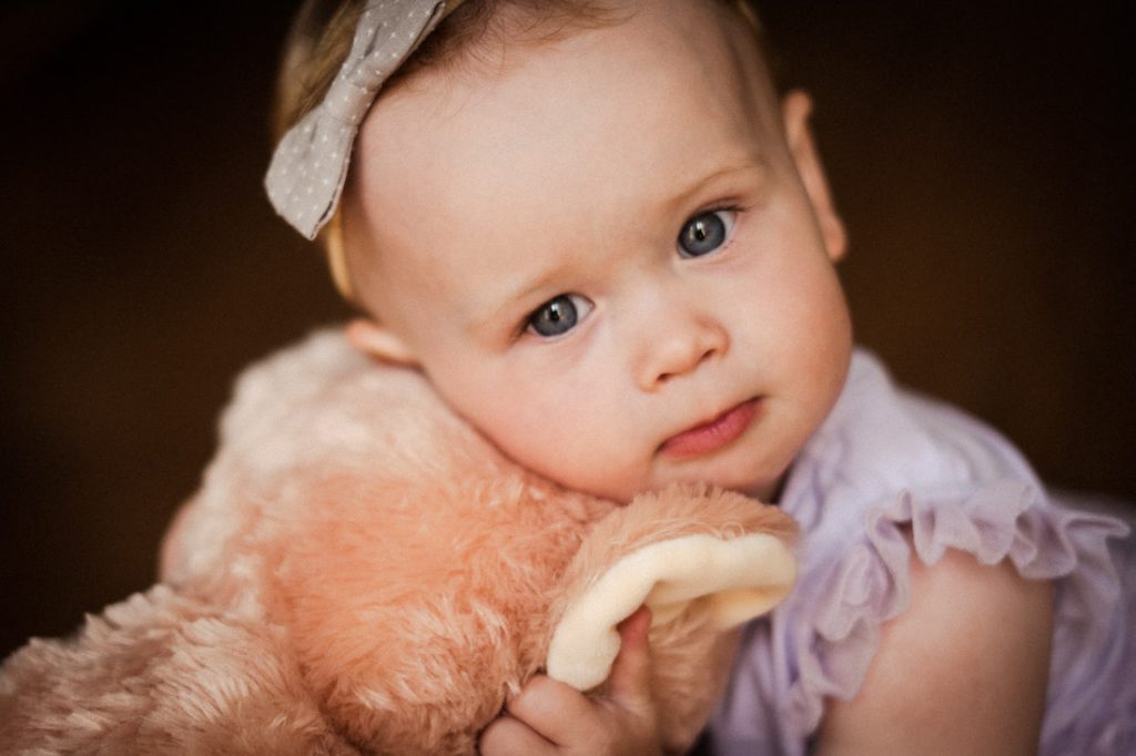 baby hugging teddy bear cute moment