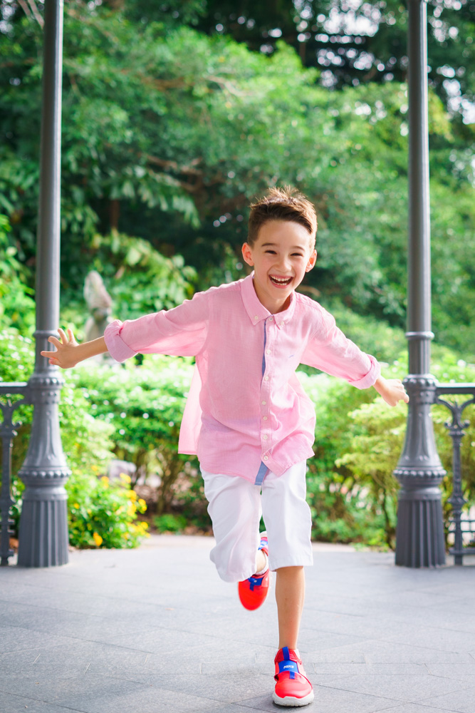 7 year old running happily at botanic gardens singapore