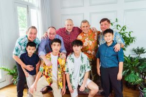 Grandfather, uncles and boys of the family during an extended family multi generation photoshoot