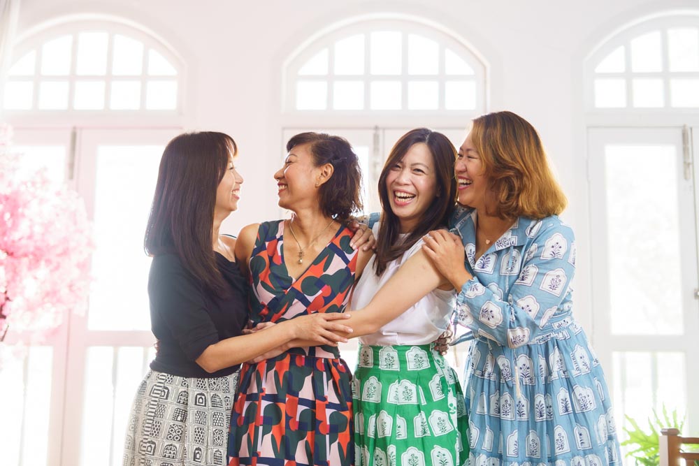 4 friends laughing in oh dear studio