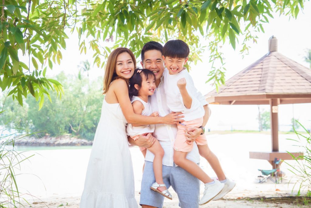 candid and laughing photoshoot young children sentosa tanjong beach