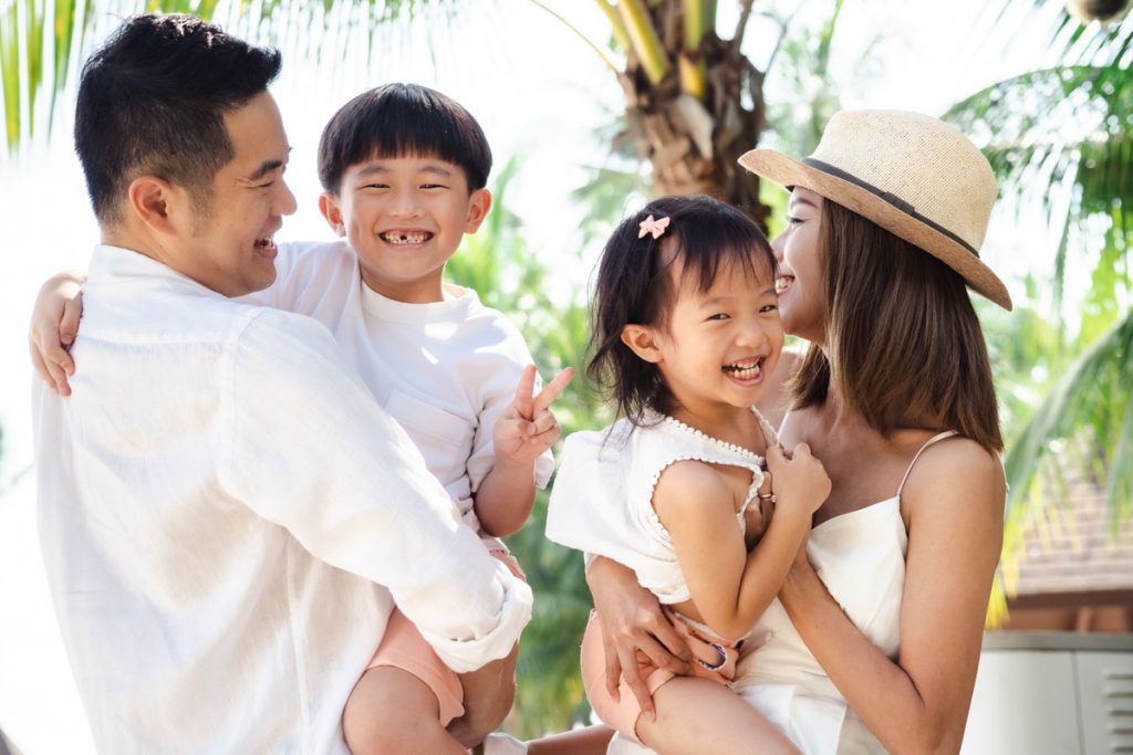 family laughing outdoor photoshoot