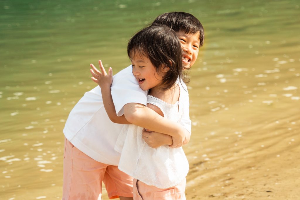 brother and sister portrait at sentosa tanjong beach