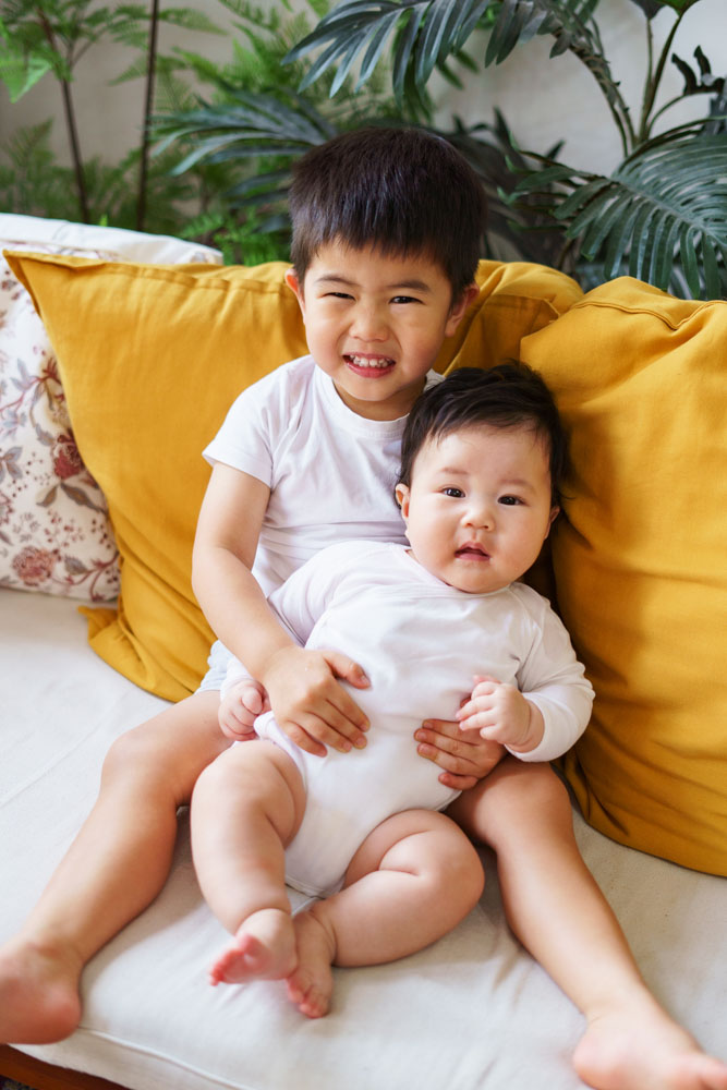 toddler and 100 day old baby sister