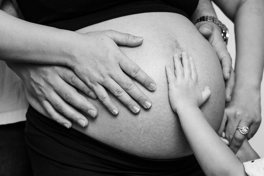 Black and white maternity close up of belly