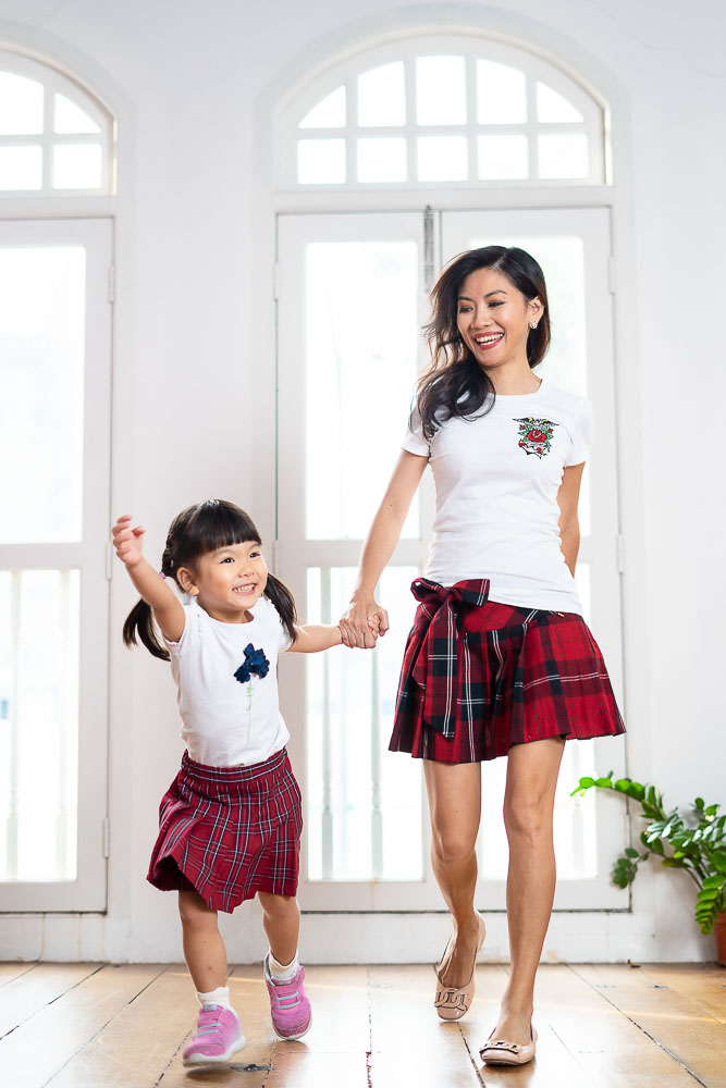 mother and young toddler daughter photoshoot fun running