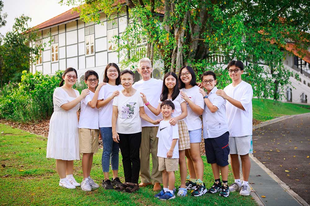 Grandparents and grandchildren during an extended big family outdoor photoshoot at Singapore Botanic Gardens